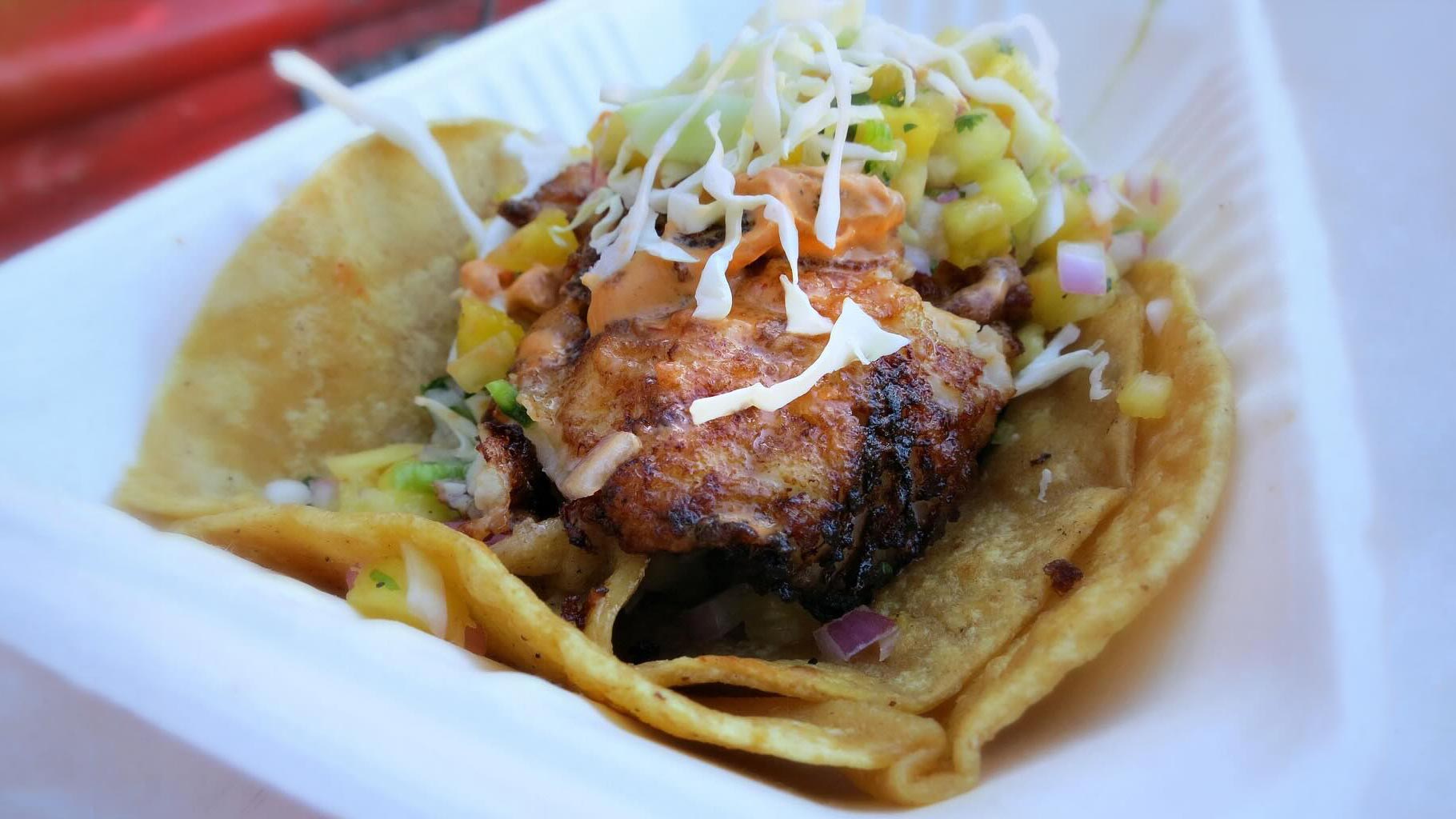 Baja Fish Taco with cabbage and Sam's special sauce wrapped in corn tortillas