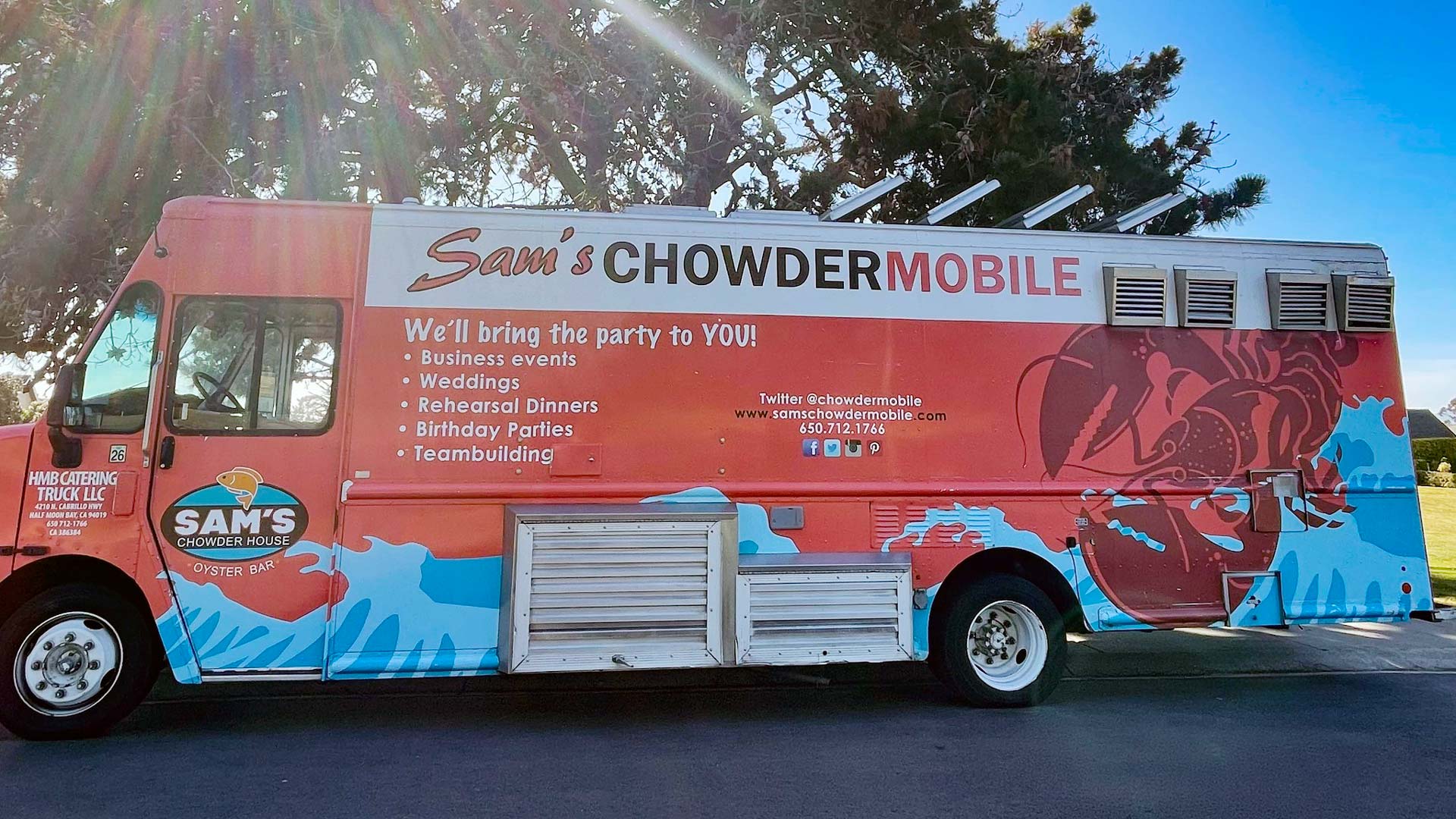 Sam's ChowderMobile catering food truck parked in sunshine in Half Moon Bay