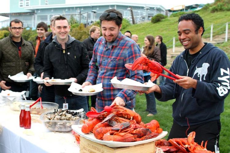 employees enjoying corporate event lobster clambake luncheon catered by Sam's